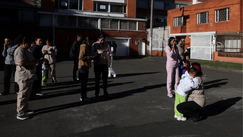 People gather outside a building following an earthquake in Bogota, Colombia, August 10, 2026. REUTERS/Luisa Gonzalez