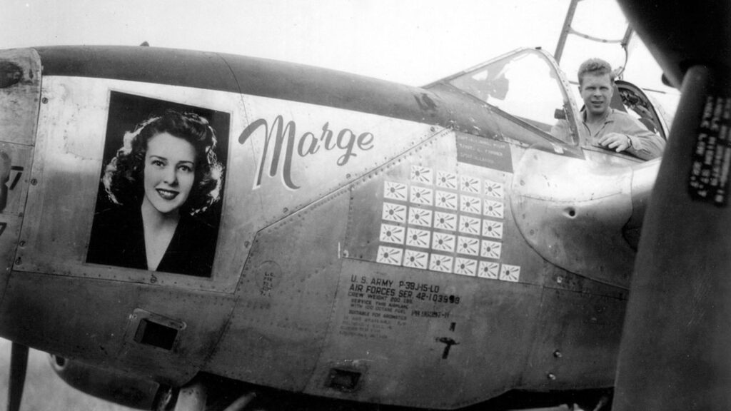A photo provided by the U.S. Army Air Forces/Pacific Wrecks shows Richard Bong in his P-38 Lightning fighter plane in March 1944, with the image of his sweetheart, Marjorie Vattendahl, on the side. A search crew found the wreckage of Bong’s missing plane on a Papua New Guinea hillside in 2024. Part of a wing will be on display at a museum honoring Bong, a World War II flying ace, in Wisconsin. (U.S. Army Air Forces/Pacific Wrecks via The New York Times)