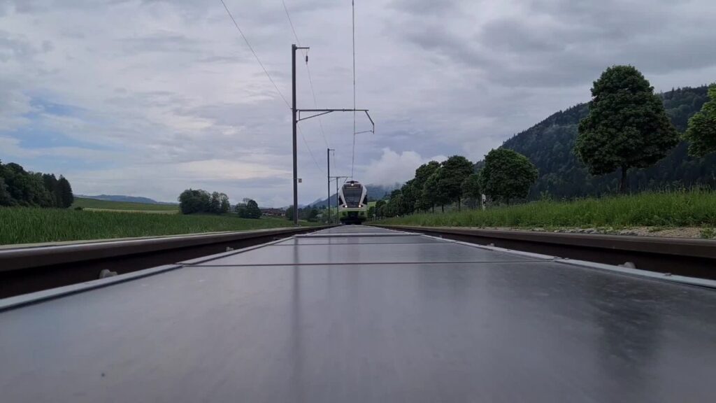 Image of solar panels installed beneath railroad tracks