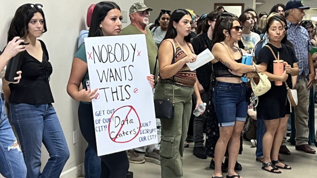 Image of data center protesters at a hearing