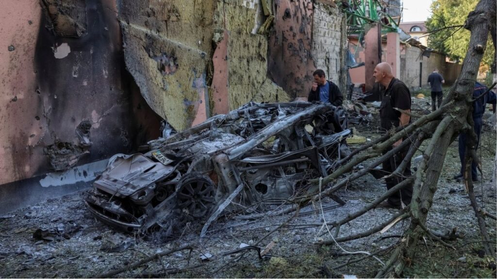 Residents look at a burned car at a site of a Russian missile strike, amid Russia's attack on Ukraine, in Kyiv region, Ukraine August 1, 2026. Reuters/Anatolii Stepanov