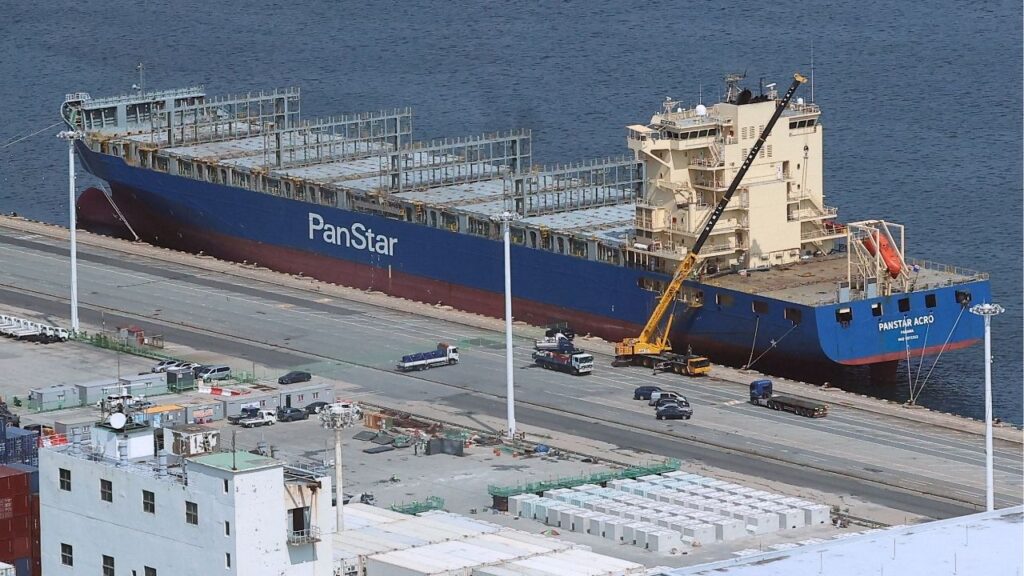 The PanStar Acro, a container ship bound for Europe via the Arctic, testing whether a route opened by melting sea ice can be commercially viable, is anchored at a port in Busan, South Korea, August 20, 2026. Yonhap via Reuters