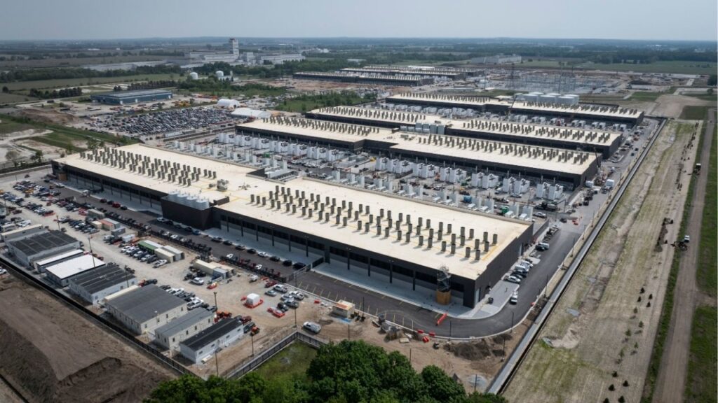 Amazon’s sprawling complex in New Carlisle, Ind., which is spread across an area that was once cornfields, on June 3, 2025. The number of artificial intelligence chips that provide the computing power to advance the fast-evolving technology is doubling every nine months. (AJ Mast/The New York Times)