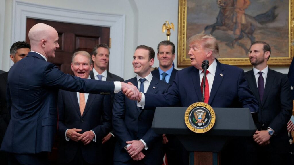 U.S. President Donald Trump shakes hands with Brian Armstrong, Coinbase Co-Founder & Chief Executive Officer, as he delivers remarks with cryptocurrency executives, in the Roosevelt Room at the White House in Washington D.C., U.S., August 19, 2026. (REUTERS/Kylie Cooper)