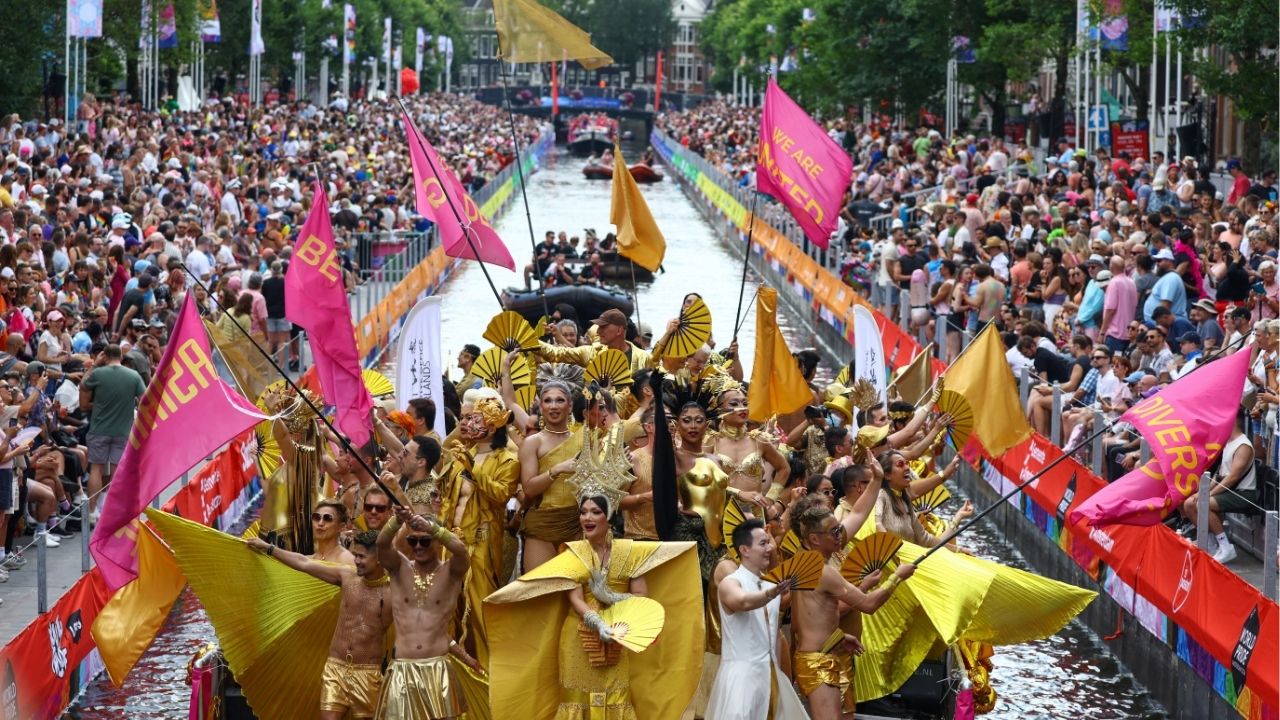 A boat filled with participants cruises the World Heritage canals during the annual Canal Parade at WorldPride in Amsterdam, Netherlands, August 1, 2026. Reuters/Thilo Schmuelgen
