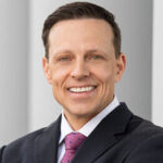 Portrait of Kaiser Permanente's Tracy Bertagnole in a dark suit