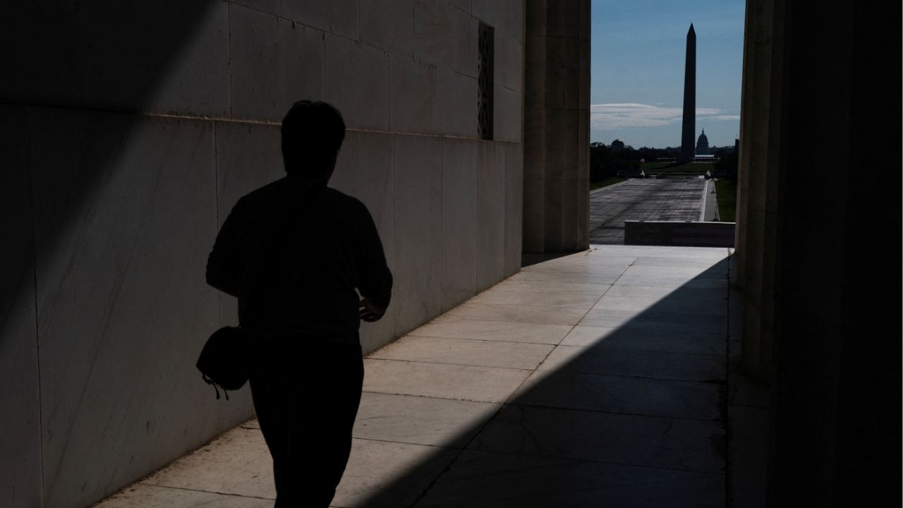 A visitor to the Lincoln Memorial walks near the drained Reflecting Pool, following renovations and Independence Day celebrations, in Washington, D.C., U.S., July 30, 2026. Reuters/Nathan Howard