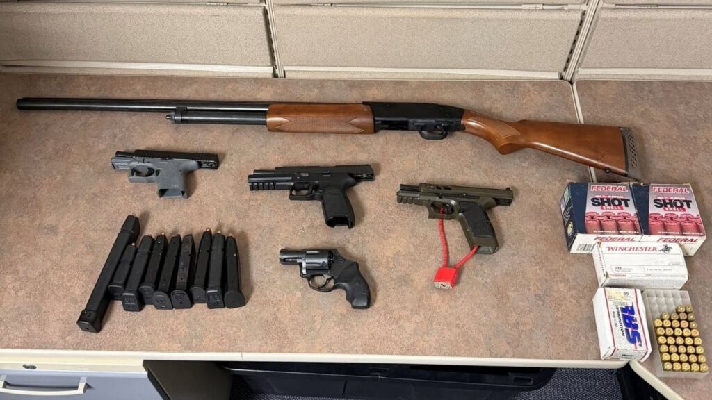 Tulare police arrested 37-year-old Aubrey Conelly after officers found several firearms while serving a search warrant tied to a burglary and vehicle theft investigation. (Tulare PD)