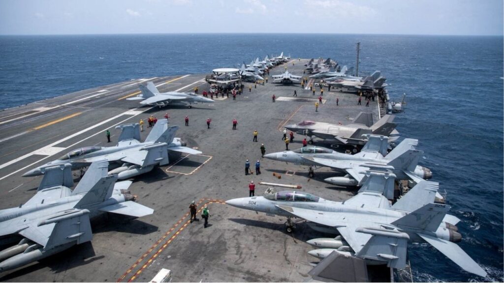 U.S. Navy sailors work on the flight deck of the aircraft carrier USS George Washington as it transits the Arabian Sea to support U.S. military operations in the war with Iran August 20, 2026. U.S. Navy/Handout via Reuters
