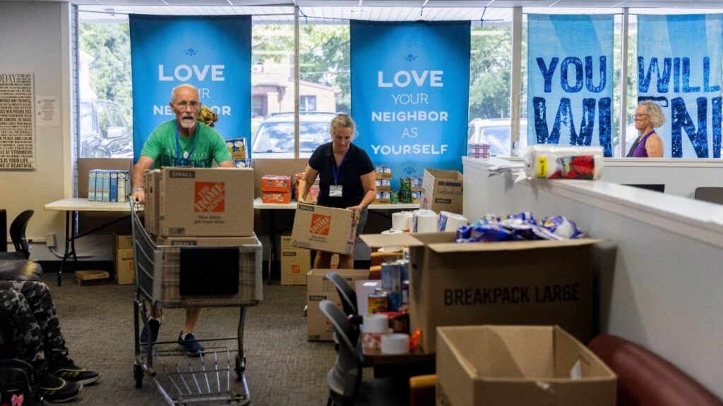 Volunteers pack food boxes for Haitian families at St. Vincent de Paul in Springfield, Ohio, on Tuesday, Aug. 18, 2026. Federal agents have begun detaining Haitians in the Ohio city, signaling an ICE ramp-up that has panicked the community and kept many from leaving home. (Maddie McGarvey/The New York Times)