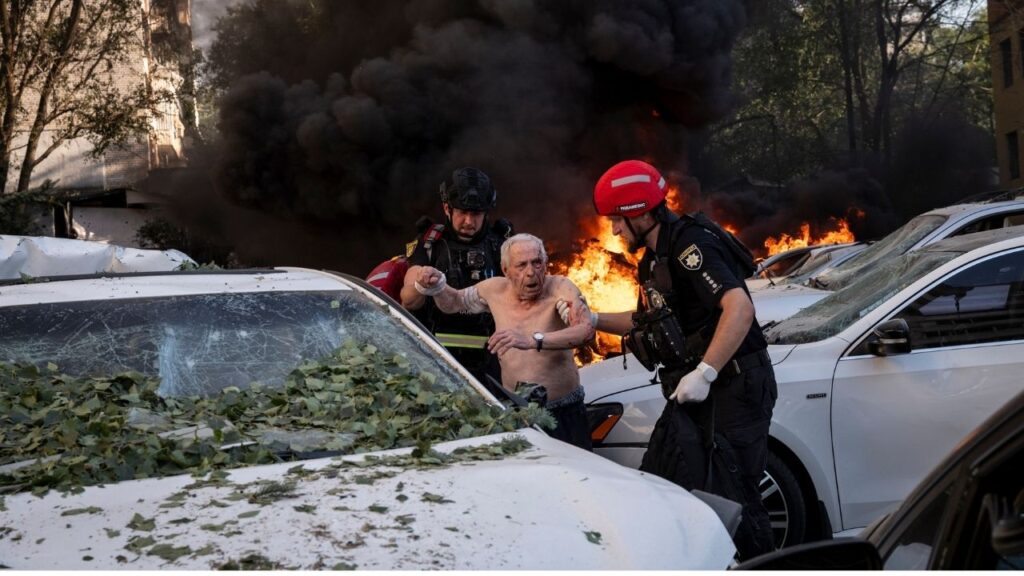 Rescuers assist an injured main after Russian strikes in Zaporizhzhia, Ukraine, Aug. 2, 2026. Many of the leaders in attendance at the Shanghai Cooperation Organization summit have helped Russia continue its war against Ukraine, now in its fifth year. (Nicole Tung/The New York Times)