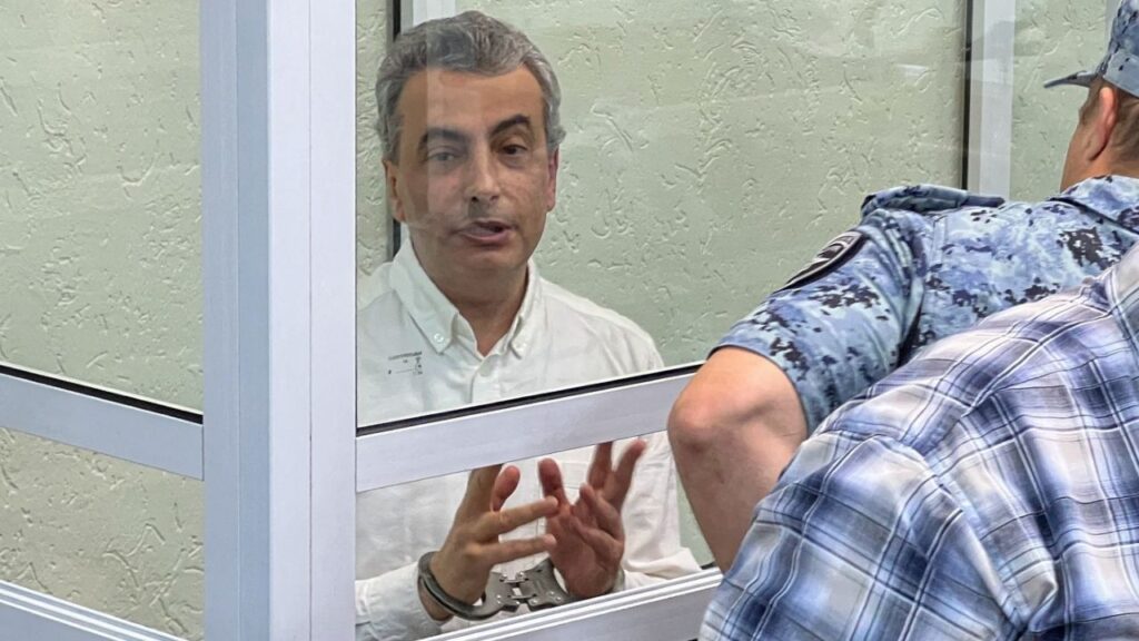 Yabloko party deputy chairman Lev Shlosberg, accused of discrediting Russia's armed forces and spreading false information about them, attends a court hearing in Pskov, Russia, August 17, 2026. REUTERS/Dmitry Vasilyev