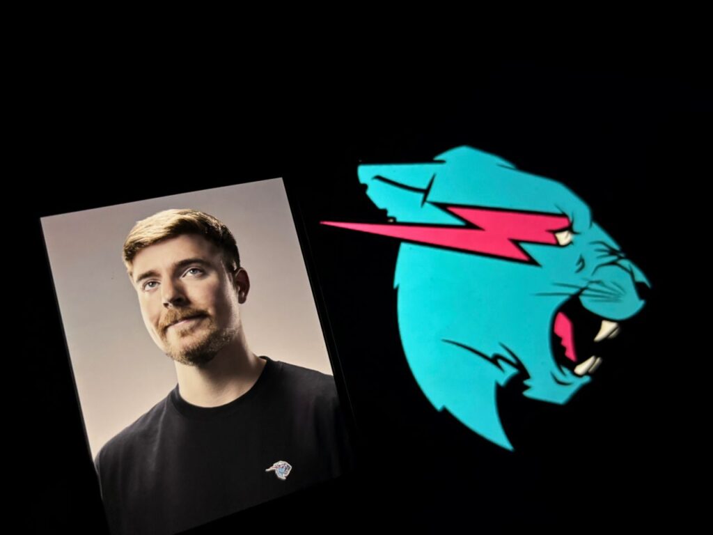 Composite image of MrBeast and his logo on a black background