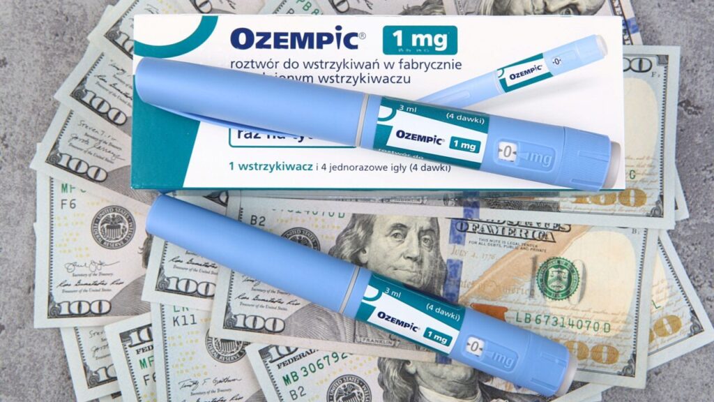 Image of two blue Ozempic injection pens and $100 bills