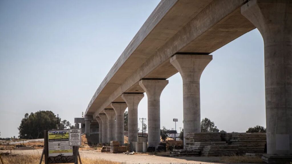 Image of a street level view of a concrete high-speed rail ramp under construction