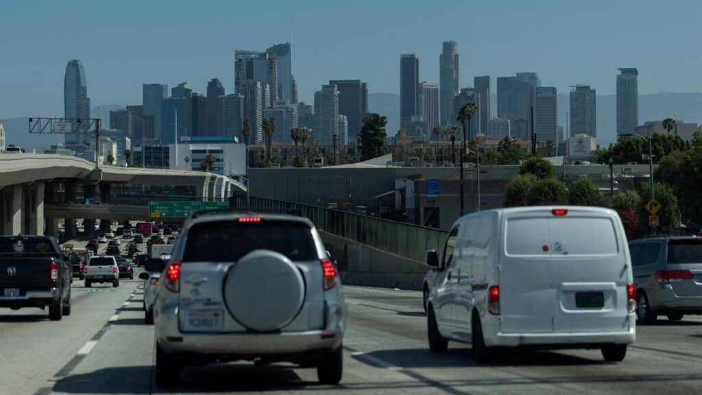 Image of cars on the freeway heading toward downtown Los Angeles with the skyline in full view