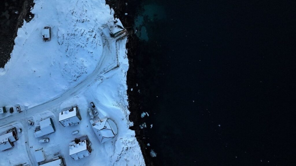A drone view shows houses on the shore of Nuuk, Greenland, February 7, 2026. REUTERS/Stoyan Nenov