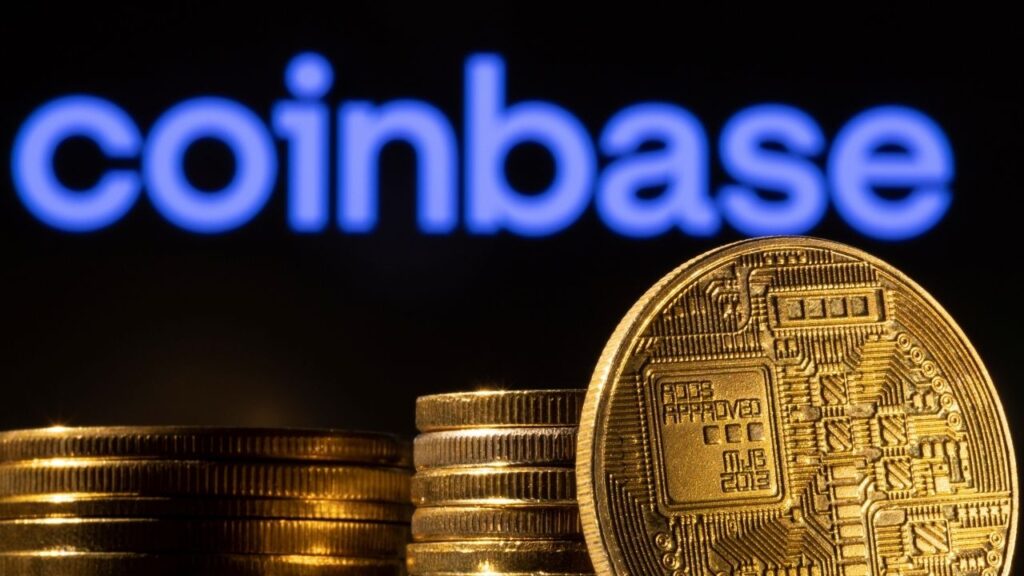 A representation of the cryptocurrency is seen in front of Coinbase logo in this illustration taken, March 4, 2022. REUTERS/Dado Ruvic/Illustration