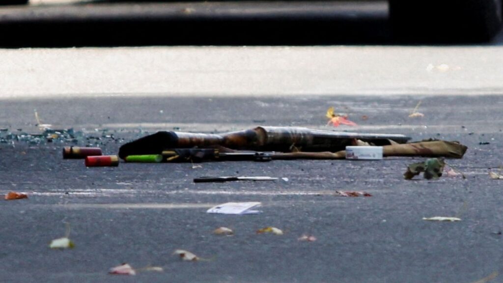 A shotgun and shotgun shells lie on the ground at the scene of a shooting where a police officer was shot outside a Yom Kippur gathering at Sons of Jacob Synagogue in Belleville, Ontario, Canada, September 21, 2026. REUTERS/Patrick Doyle