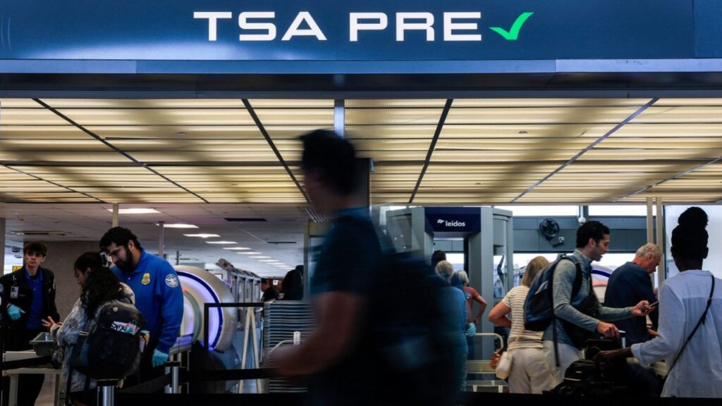 A traveler walks through the Transportation Security Administration (TSA) 'PreCheck' line at Washington Dulles International Airport, in Dulles, Virginia, U.S., August 4, 2026. REUTERS/Kylie Cooper