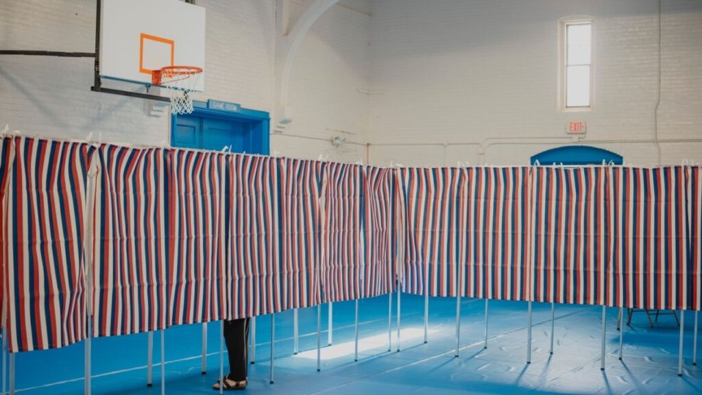 A voter at a polling location on primary election day in Concord, N.H., Sept. 8, 2026. Patagonia, the outdoor apparel company, is offering customers a financial incentive to encourage friends and family to make a plan to vote in the midterm elections. (John Tully/The New York Times)