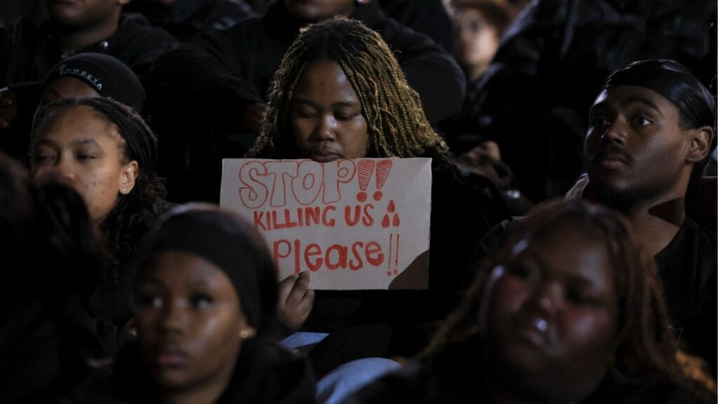 A student holds a placard at the University of Cape Town during a vigil for victims of gender-based violence and femicide, while calling for stronger action against violence against women following a spate of killings in recent months around Johannesburg, in Cape Town, South Africa, September 18, 2026. Reuters/Esa Alexander
