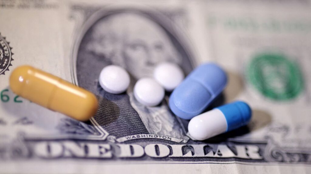 U.S. dollar banknote and medicines are seen in this illustration taken, June 27, 2024. (REUTERS/Dado Ruvic/Illustration)