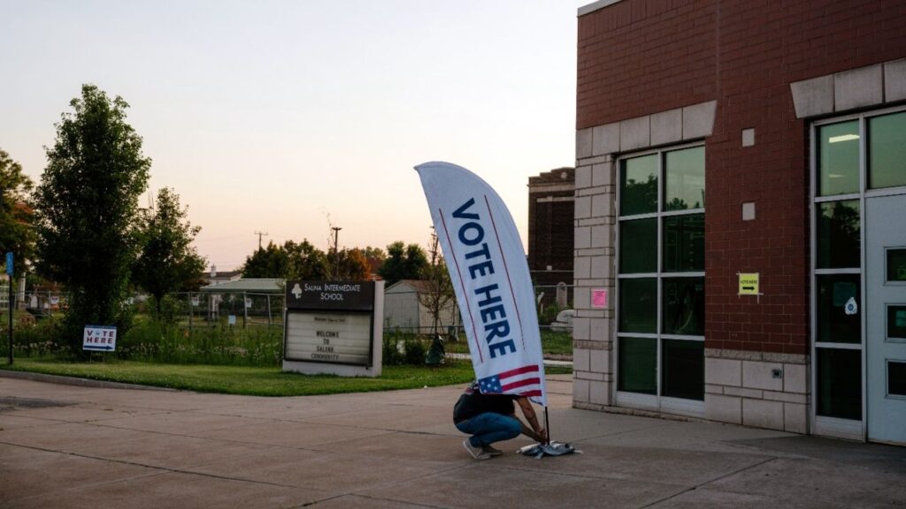 An elections workers sets up a directional sign for voters on Primary Election Day in Dearborn, Mich., on Aug. 4, 2026. Polls in several closely watched primaries over the summer were off by wide margins, but pollsters remain confident that general elections are a different story. (Nick Hagen/The New York Times)