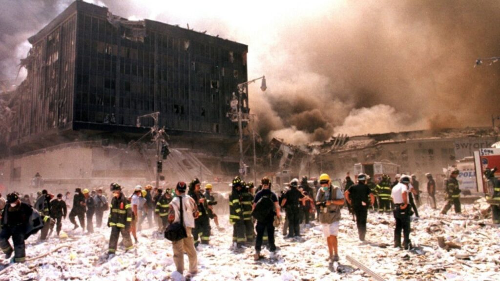 New York City firefighters and other emergency personnel battle building blaze after the World Trade Center buildings collapse September 11, 2001. Three hijacked planes slammed into the [Pentagon] and New York's landmark World Trade Center on Tuesday, demolishing the two 110-story towers that symbolize U.S. financial might. (REUTERS/Anthony Correia/File Photo)