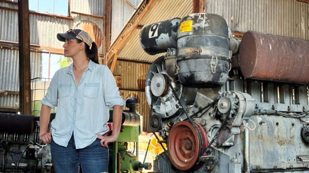 Democratic U.S. Senate candidate and crop farmer Hallie Shoffner stands near old equipment inside her family's shuttered cotton gin in Shoffner, Arkansas, U.S. June 1, 2026. Picture taken with a mobile phone. REUTERS/P.J. Huffstutter