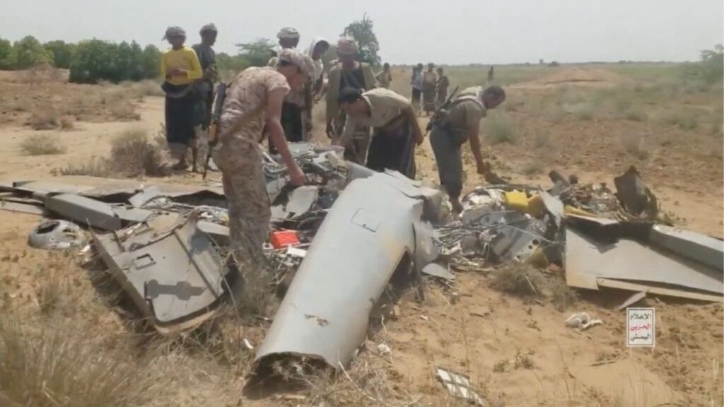 Members of Houthis inspect a drone, which they say is the wreckage of an armed reconnaissance drone 'Karayel,' belonging to the Saudi, as it lies on the ground in a location given as Hajjah, Yemen, in this screengrab taken from a handout video released on September 10, 2026. Houthi Media Centre/Handout via Reuters