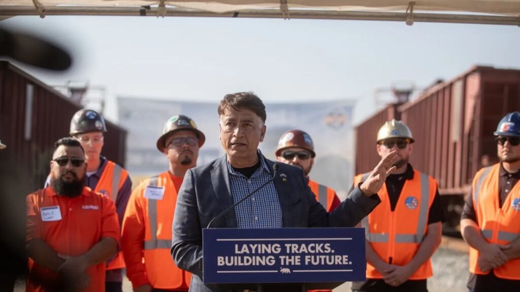 Ian Choudri, CEO of California High Speed Rail, speaks during a press conference on the high-speed rail project at the Wasco Rail Yard facility in Wasco on Feb. 3, 2026. Photo by Larry Valenzuela, CalMatters