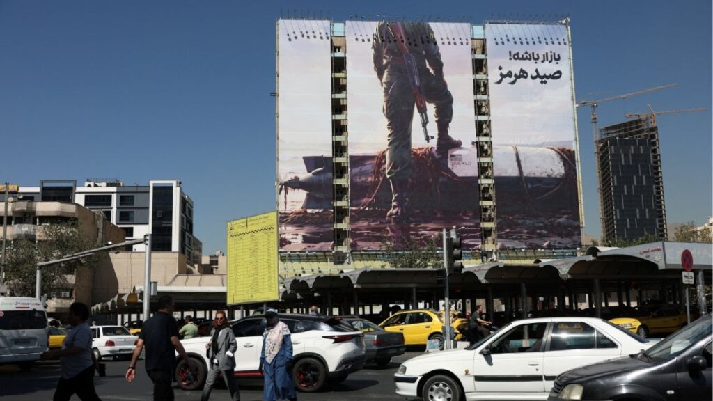 People walk past a billboard with a picture of an unmanned U.S. submersible, in Tehran, Iran, September 23, 2026. Majid Asgaripour/WANA (West Asia News Agency) via Reuters
