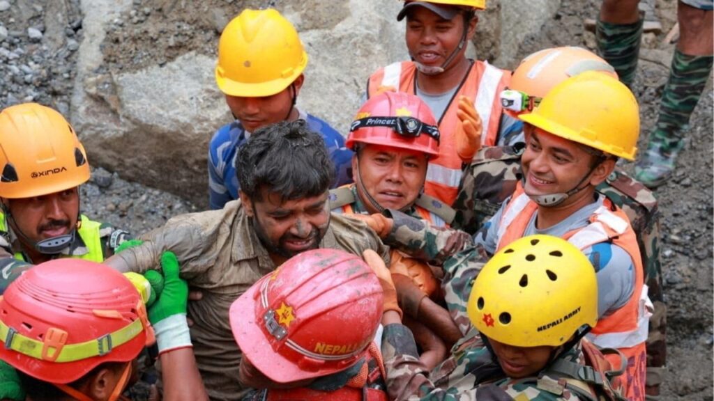 Survivor Sanjay Sah is carried by members of a search and rescue team after they rescued alive two people who had been trapped inside a tunnel at the Upper Trishuli-3A Hydropower Project following devastating floods and mudslides that struck the Bhotekoshi River in Rasuwa, Nepal, September 4, 2026. Nepal Army/Handout via Reuters.