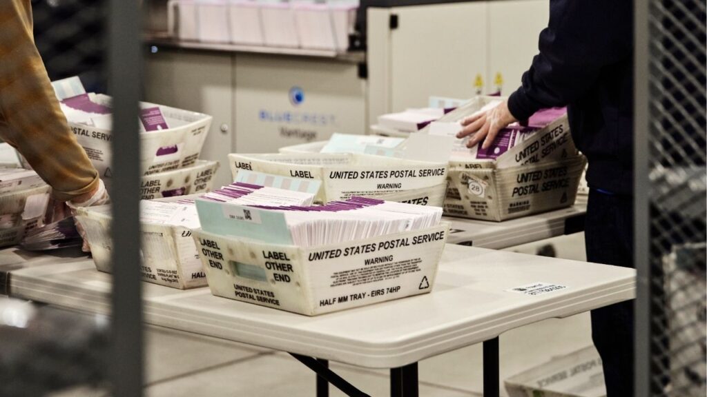 People sort ballots at a processing center during a statewide special election in City of Industry, Calif., on Nov. 4, 2025. The U.S. Postal Service’s internal watchdog is opening an investigation into concerns raised in a whistle-blower report about the agency’s hasty effort to build a complex online system with voter data ahead of the midterm elections. (Philip Cheung/The New York Times)