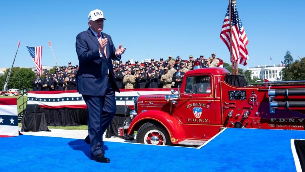 President Donald Trump joins in the applause as he leaves the stage after speaking on Tuesday, Sept. 8, 2026, at an event on the Ellipse in Washington honoring emergency personnel who died 25 years ago during the Sept. 11 attacks. President Trump is poised to become far more visible outside of the White House than he has been for most of his term, starting with a Republican midterms convention in Texas and, according to his aides, continuing with travel to boost other candidates heading into November. (Doug Mills/The New York Times)