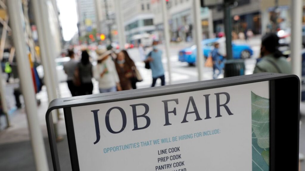 Signage for a job fair is seen on 5th Avenue after the release of the jobs report in Manhattan, New York City, U.S., September 3, 2021. REUTERS/Andrew Kelly