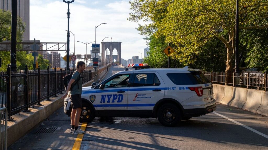 The ramp leading to the eastbound side of the Brooklyn Bridge is briefly closed on Friday morning, Sept. 4, 2026, after a fatal police shooting. The police shot and killed a man early Friday morning after he climbed the cables of the bridge, raised his arm and extended a knife toward officers, officials said at a news conference. (Dakota Santiago/The New York Times)