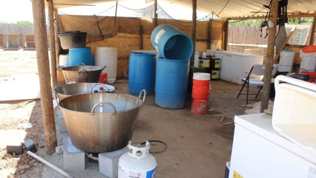 Three men were arrested after federal agents dismantled a methamphetamine conversion lab in Terra Bella, seizing about 100 pounds of crystal methamphetamine, $600,000, and six firearms. (Department of Justice)