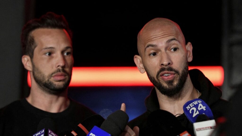 Tristan and Andrew Tate deliver a press statement in front of their house after landing back in Romania, near Bucharest, Romania, March 22, 2025. (Reuters File)