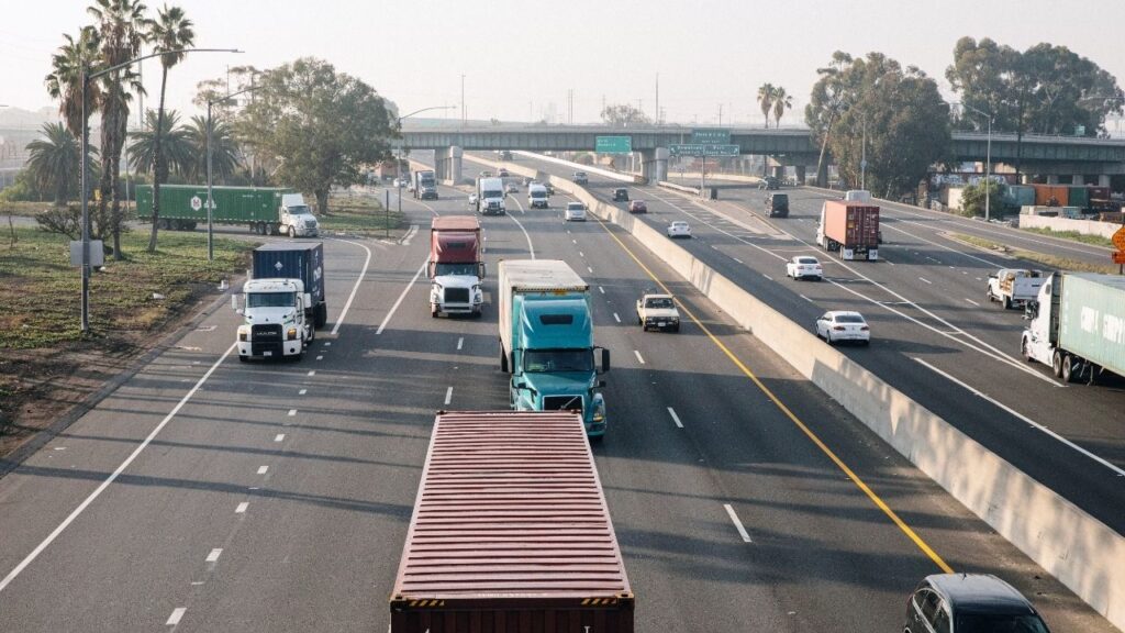 Trucks pass along I-710 in Long Beach, Calif., not far from the Port of Los Angeles, on Nov. 1, 2021. Diesel fuel prices jumped to a record high in the United States on Friday, Sept. 4, 2026, as the war in Iran continued to restrict the supply of energy worldwide, further squeezing businesses that rely on diesel to run their factories and equipment. (Stella Kalinina/The New York Times)