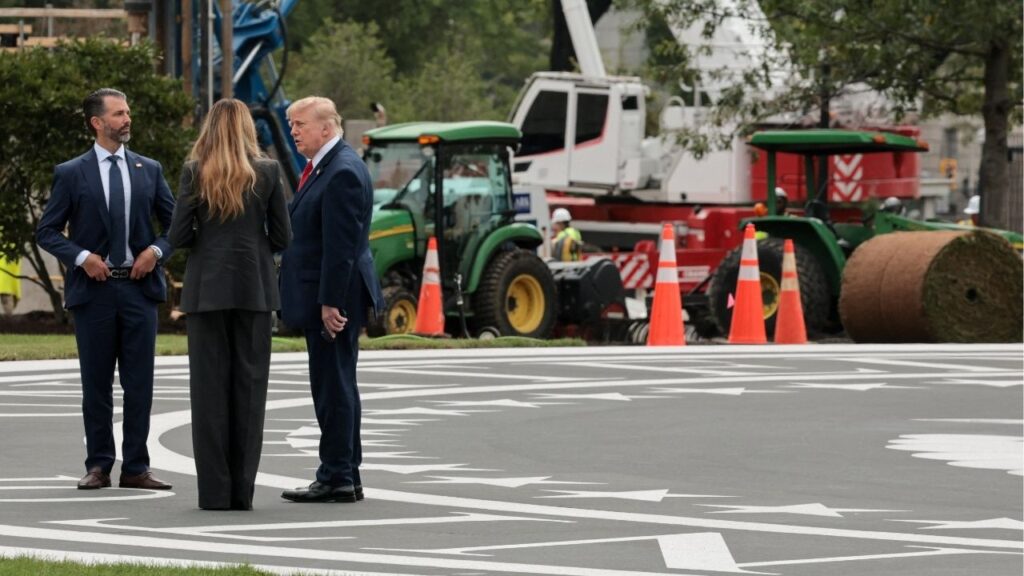 U.S. President Donald Trump, with first lady Melania Trump, shows his son Donald Trump Jr. the construction on the new helipad on the South Lawn of the White House in Washington, D.C., U.S., September 11, 2026. Reuters/Jonathan Ernst