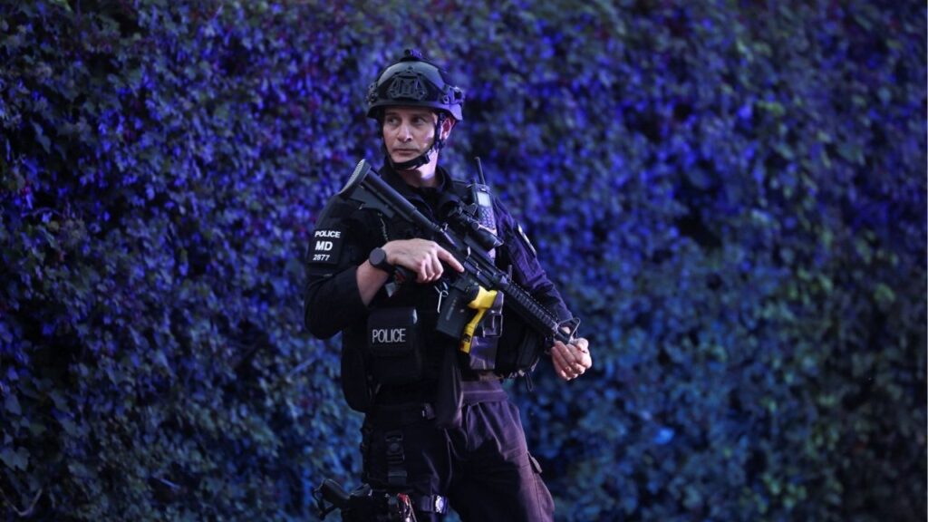 A police officer blocks a road near the RAF Fairford airbase, which hosts United States Air Force (USAF) personnel, in Fairford, Gloucestershire, Britain, September 27, 2026. Reuters/Toby Shepheard