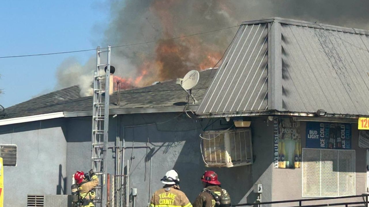Tulare County firefighters are battling a commercial structure fire near Farmersville that has closed part of Road 156. (Tulare County FD)