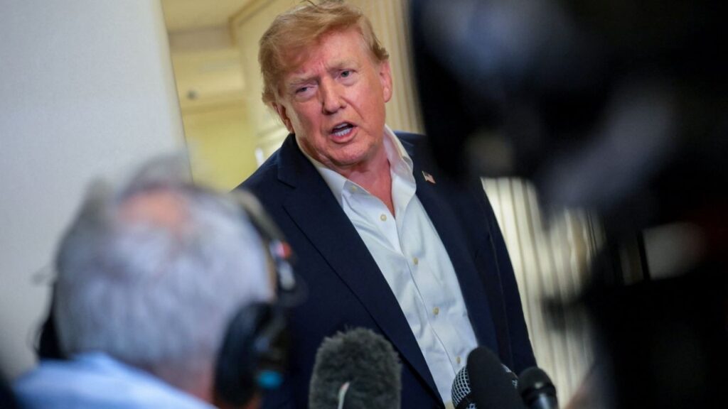 U.S. President Donald Trump speaks to members of the media aboard Air Force One, en route to Joint Base Andrews, Maryland, U.S., following a two-day visit to Ireland, September 13, 2026. REUTERS/Kylie Cooper