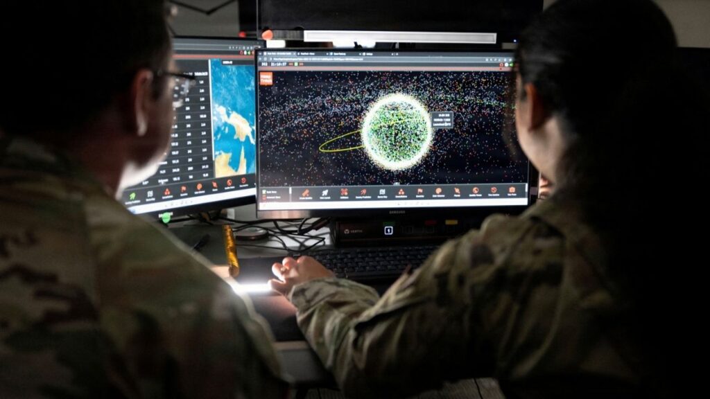 U.S. Space Force Guardians assigned to Space Delta 5 monitor computer workstations at Vandenberg Space Force Base, California, U.S., December 18, 2025. U.S. Space Forces/David Dozoretz/Handout via REUTERS