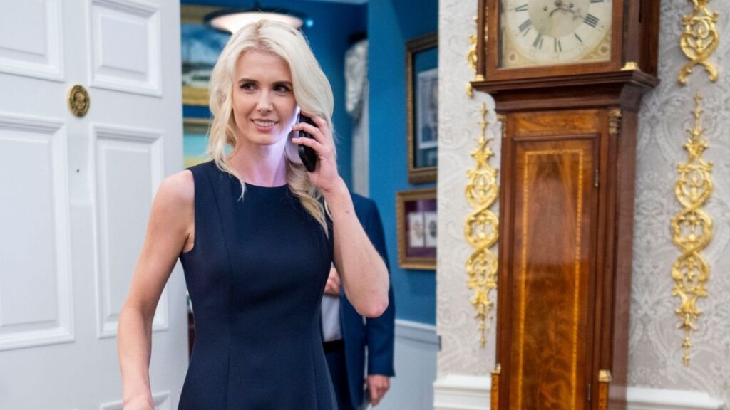 White House special assistant Natalie Harp is seen on the phone as President Donald Trump makes remarks during an announcement on Healthcare Affordability, in the Oval Office, Monday, Aug. 31, 2026. President Trump provided a “cash gift for the holidays” to three White House aides last year, handing out $45,000 each to his executive assistant Natalie Harp and two other employees who work in the West Wing, according to financial disclosure forms. (Doug Mills/The New York Times)