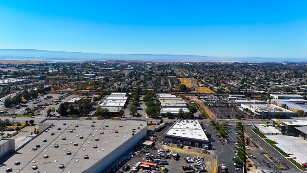 Aerial view of industrial area in a city beneath a blue sky