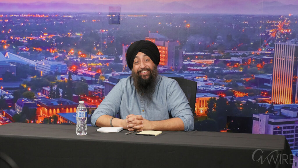 Image of Fresno City Council candidate Naindeep Singh against a studio backdrop of Fresno
