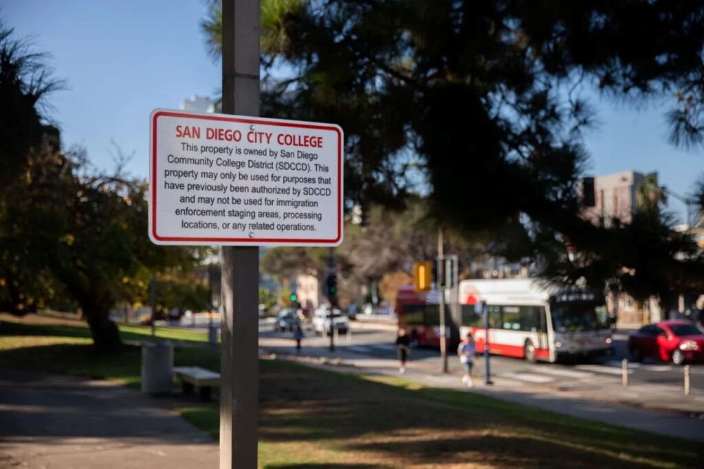 Image of a sign banning immigration enforcement agents from entering a college campus